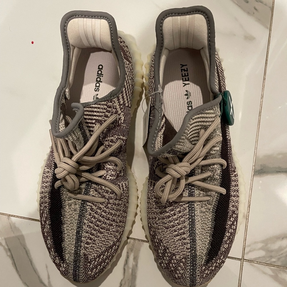 Brand new Yeezy size 9 for men size 10 for women. cream, brown and gray